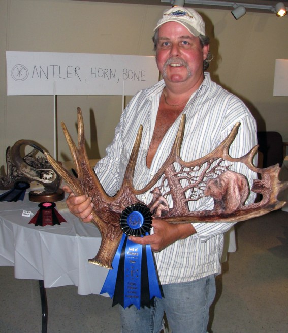 First Place, Coloured Antler - ‘Grizzly and Miner’ by Rob Baumann First Place, Coloured Antler - ‘Grizzly and Miner’ by Rob Baumann