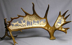 'Three Deer, Turkey and a Bear' (carved moose antler, deer antler support) by Bill Matz