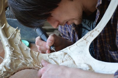 Dmitry Gorodetsky renders beautifully carved detail onto one of his moose antler sculptures.