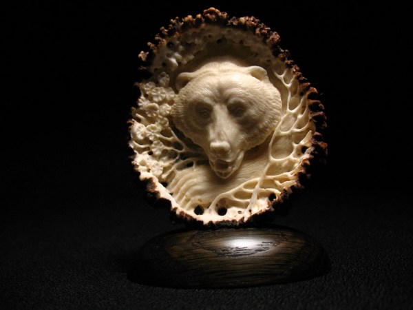 'Bear in Blossoms' by Dmitry Gorodetsky (carved deer antler - 5cm x 8cm)