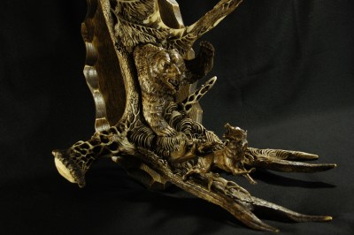 'A Sudden Encounter' by Dmitry Gorodetsky (carved and stained moose antler and wood - 23cm x 45cm)