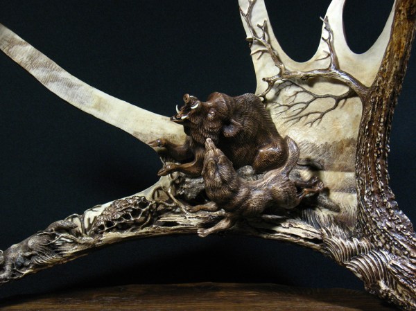 7. 'Wild Boar and Laika - 2' by Dmitry Gorodetsky (carved and stained moose antler and wood - 45cm x 25cm)