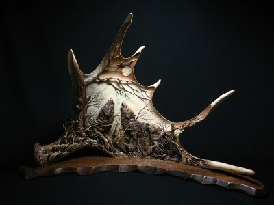 'The Three Howling Wolves' by Dmitry Gorodetsky (carved and stained moose antler - 42cm x 23cm)