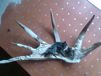 Phase 2 - The figures are modelled in plastercine and fitted to the moose antler background, prior to being carved in wood. (Dmitry Gorodetsky mixed media moose antler sculpture, in progress)
