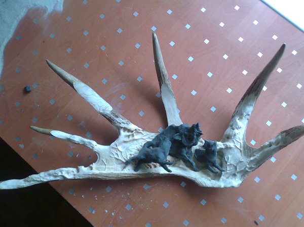 Phase 2 - The figures are modelled in plastercine and fitted to the moose antler background, prior to being carved in wood. (Dmitry Gorodetsky mixed media moose antler sculpture, in progress)