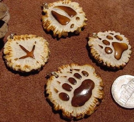 Small track carvings in antler by Jack Brown, similar to ones he sold on eBay