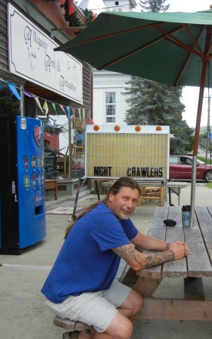 Jack Brown taking a break from carving to get some fresh air out in front of his studio/gallery in Scio, N.Y. USA